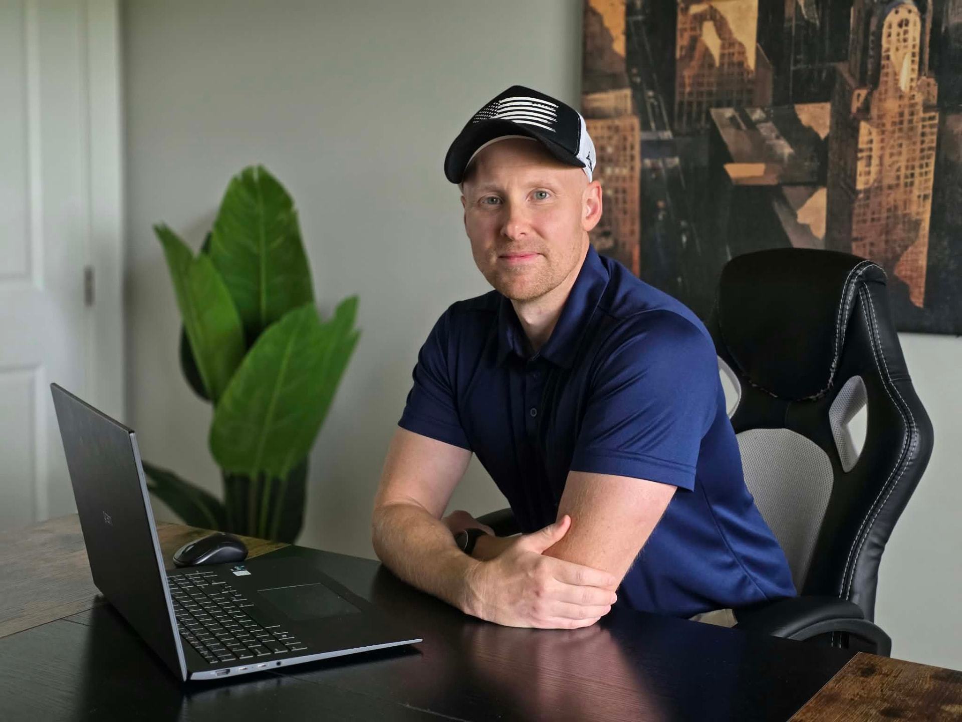 Derek James at his desk